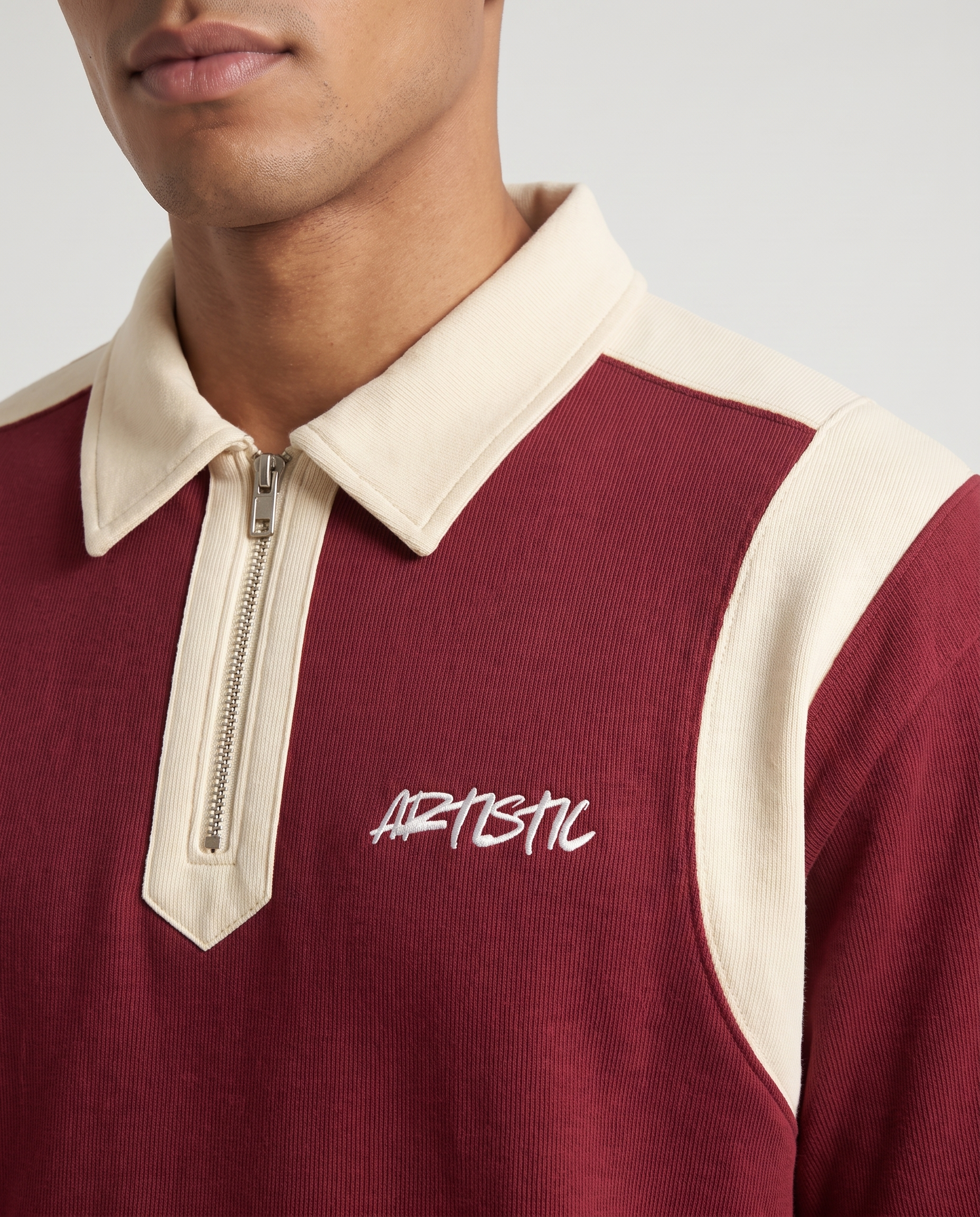 The Wine Club zip polo — collar and logo detail