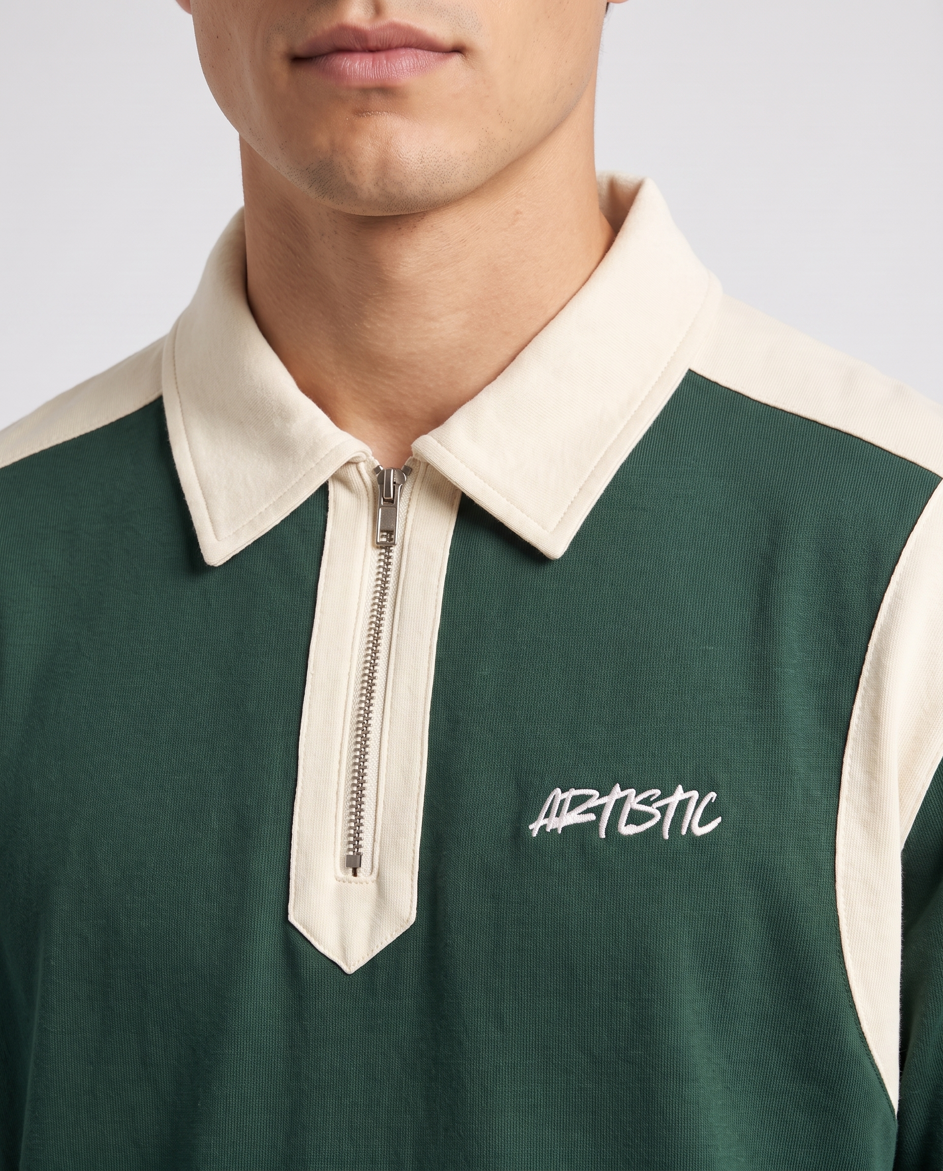 The Ink Well zip polo — collar and logo detail